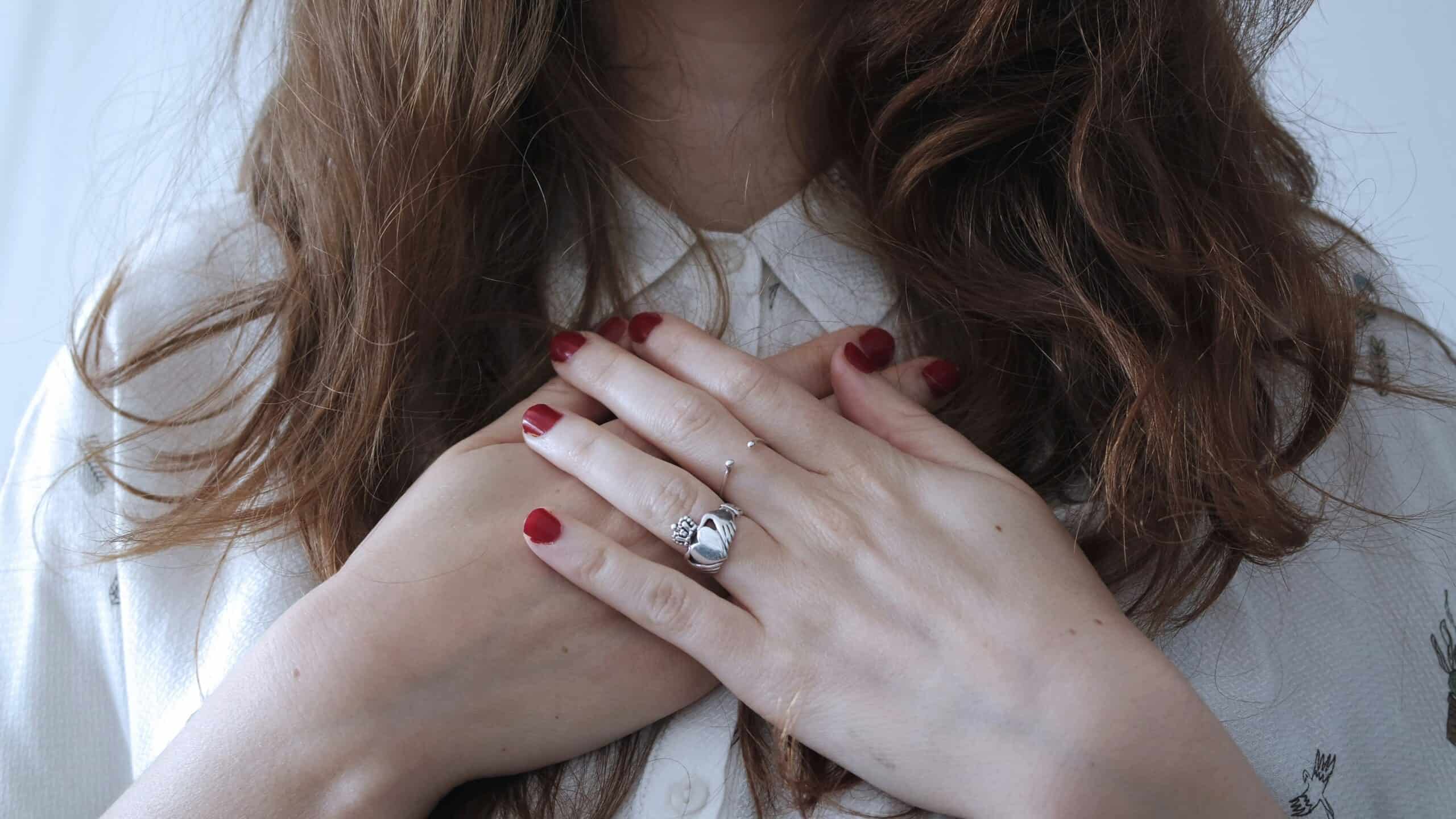showing the body of woman with a symptom of heart diseases or heart attack