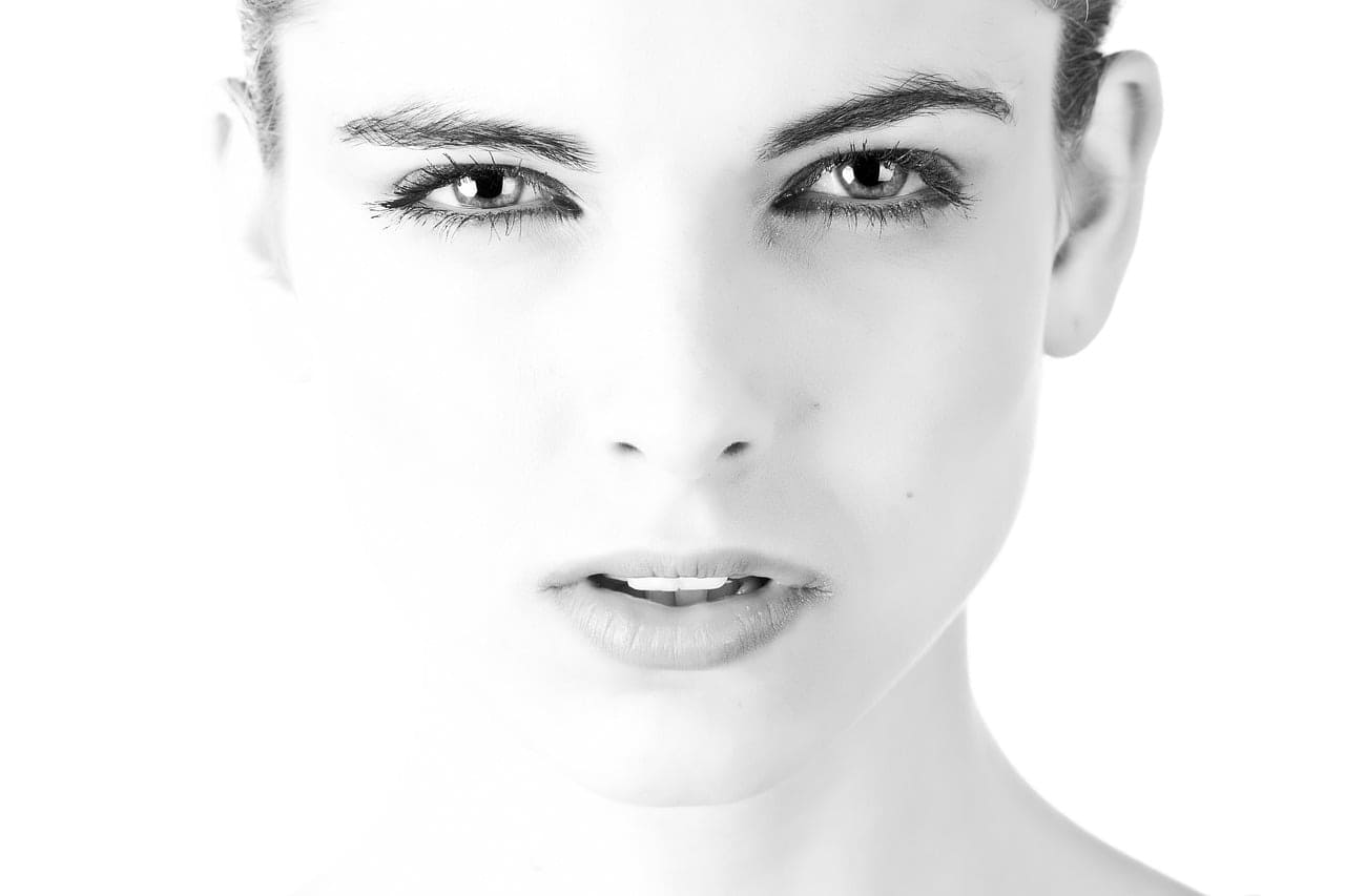 A woman with beautiful black eyes staring at the camera