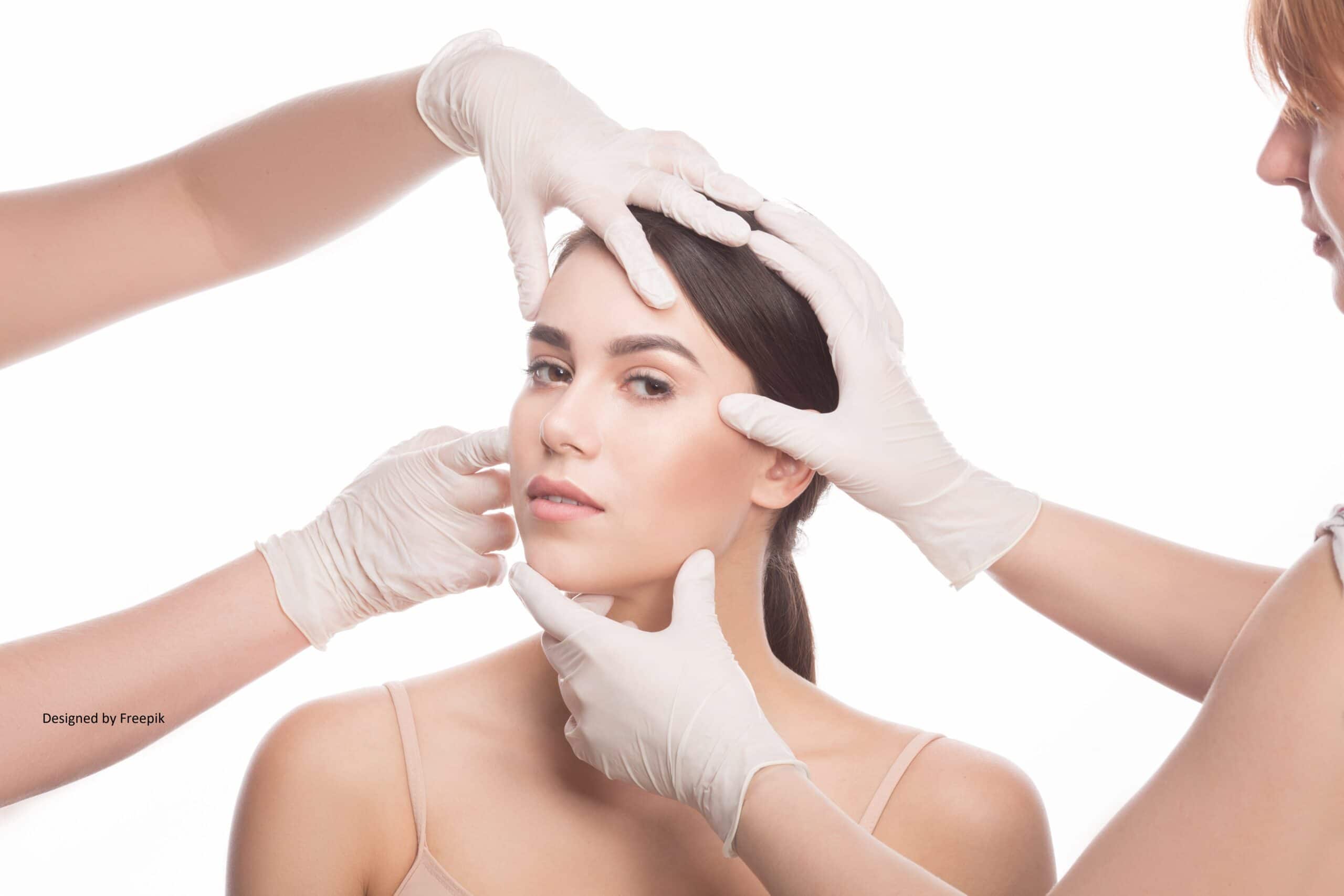 beautiful young-woman keeping eyes-opened while four-hands with medical-gloves touching her-face